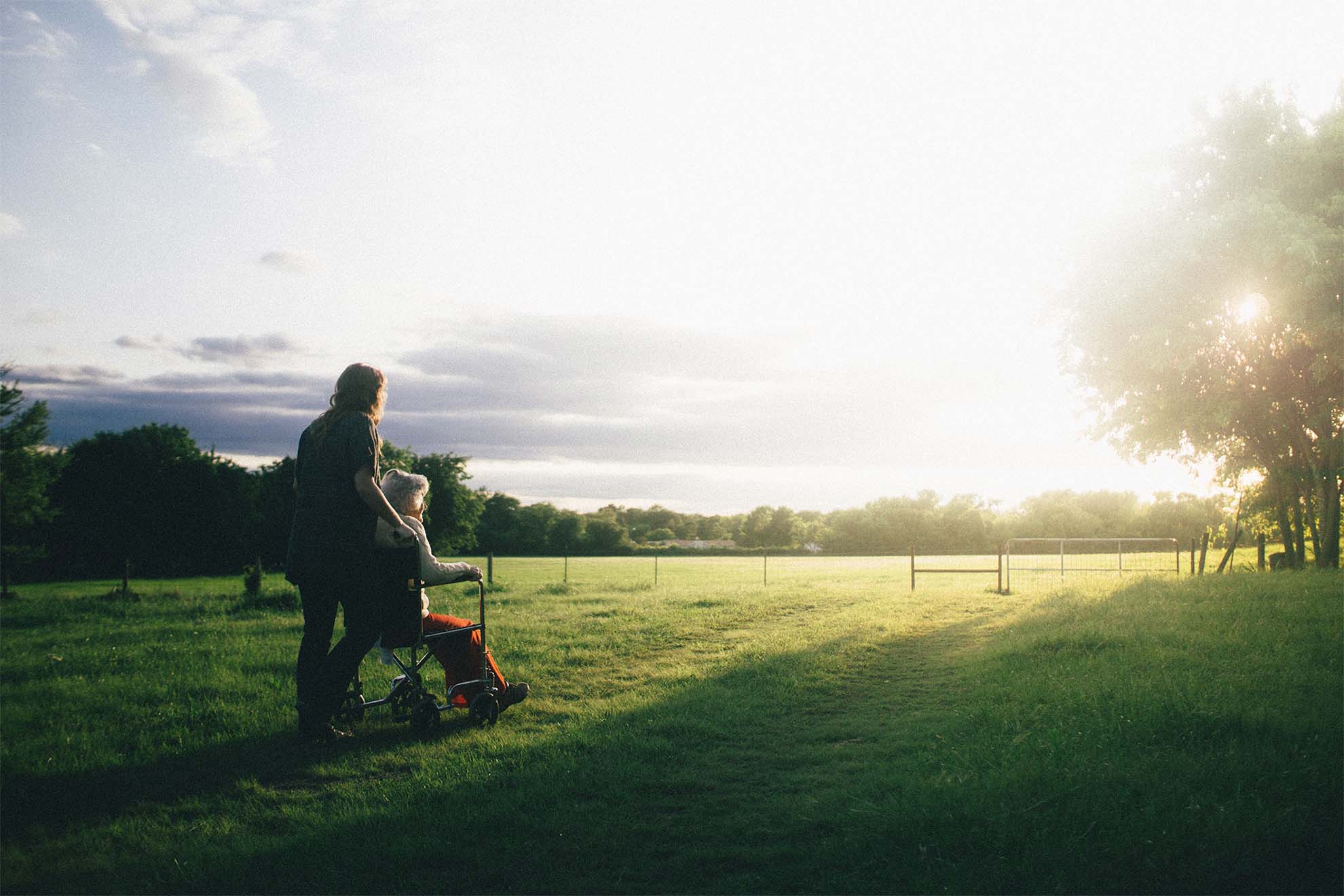 resident on a walk with carer