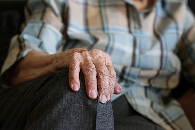 resident with his hand on his knee