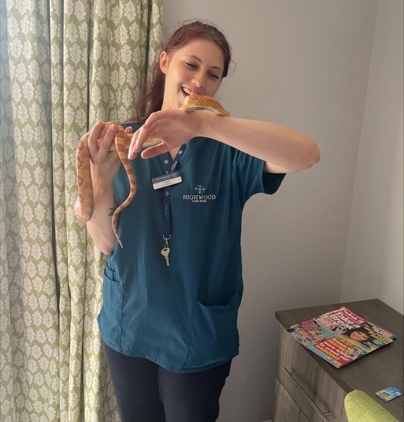 care team holding snake