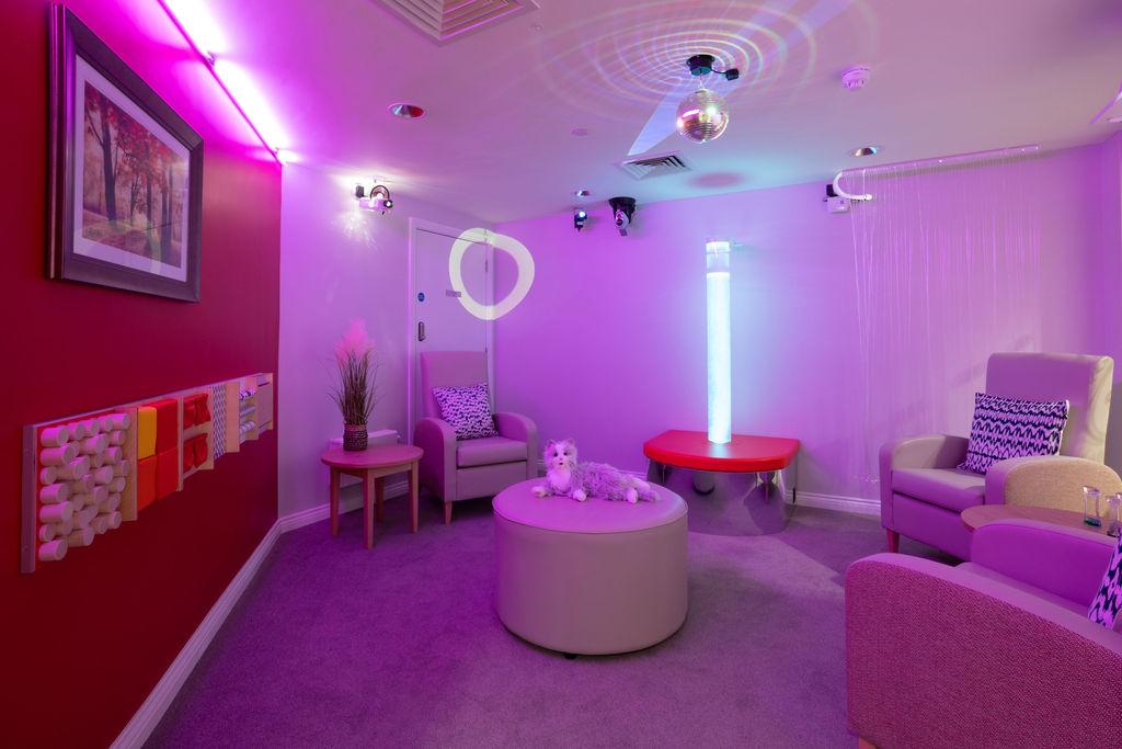 our sensory room with pink lighting