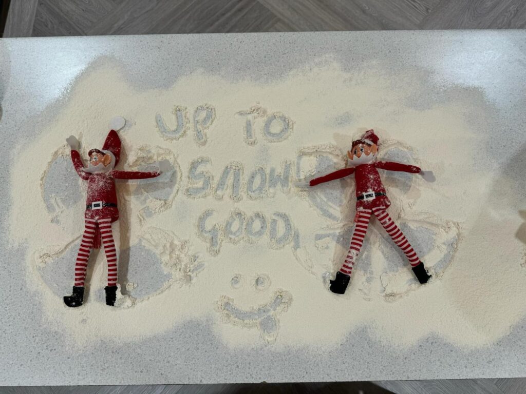 elves making snow angels in the flour