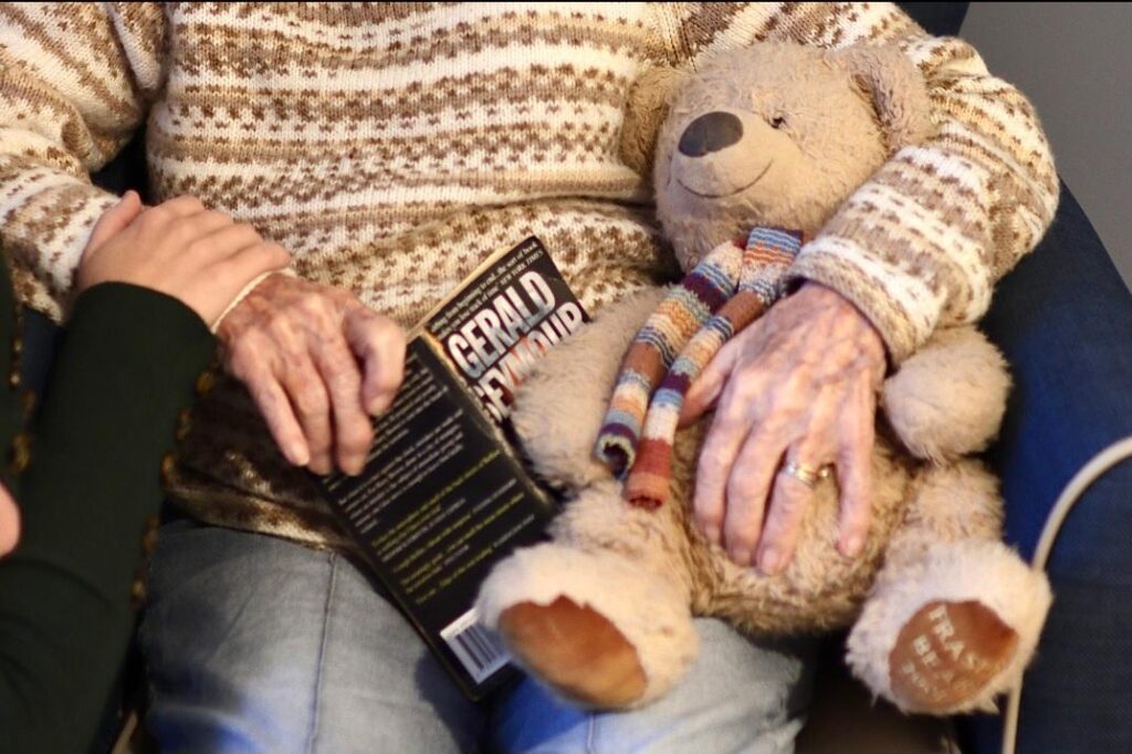 resident sat reading a book