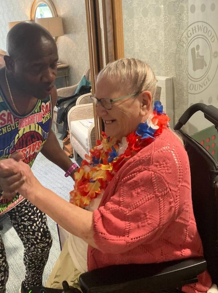 resident on her birthday dancing with entertainer