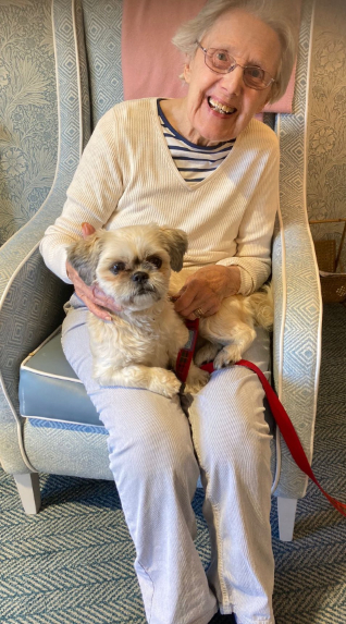Resident enjoying pet therapy
