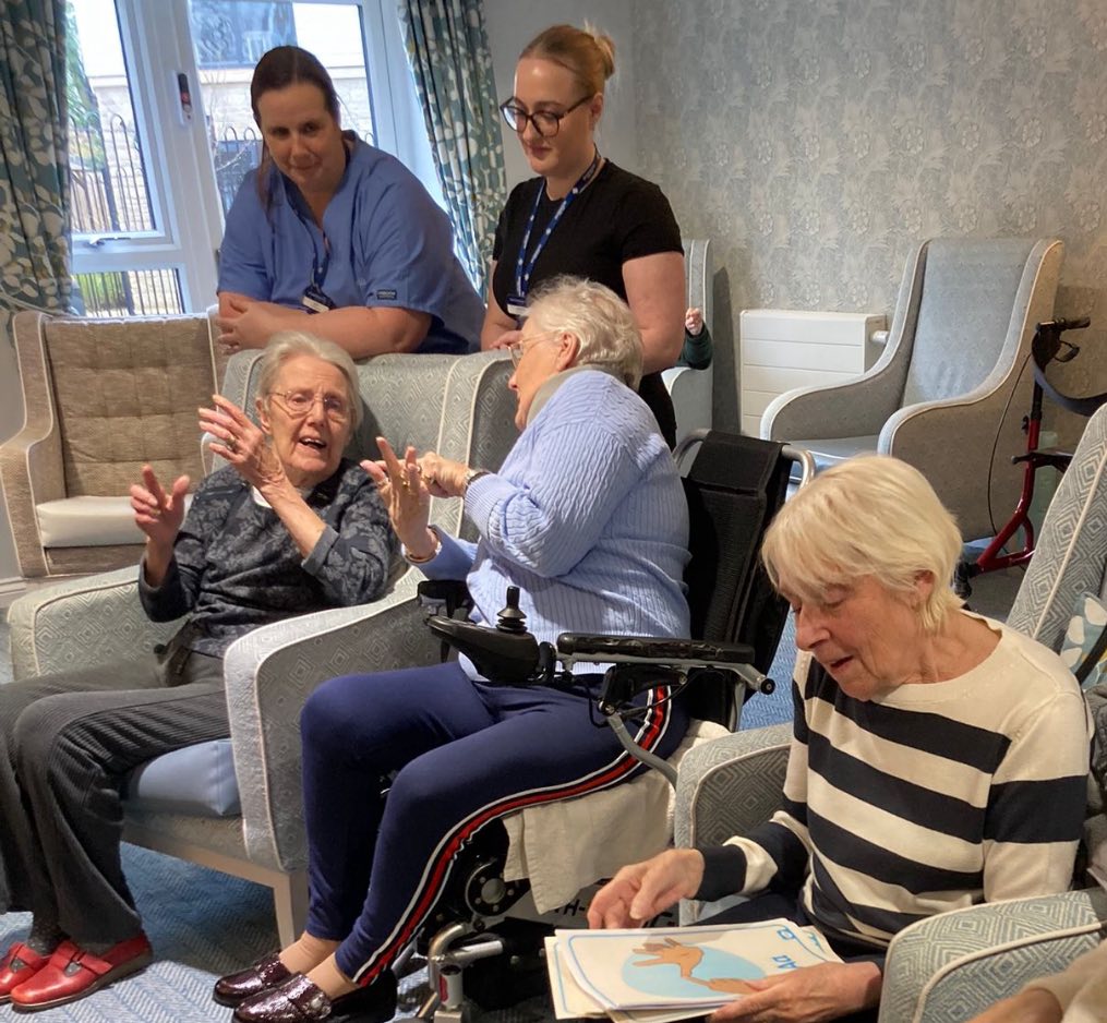 Residents enjoying activities in the lounge