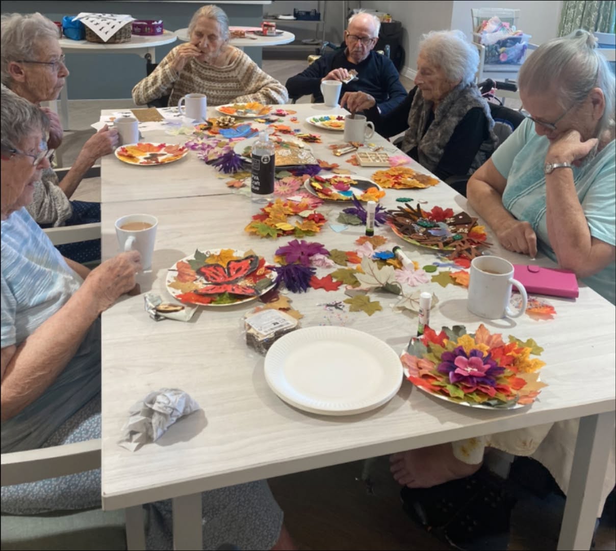 residents participating in autumn craft activity